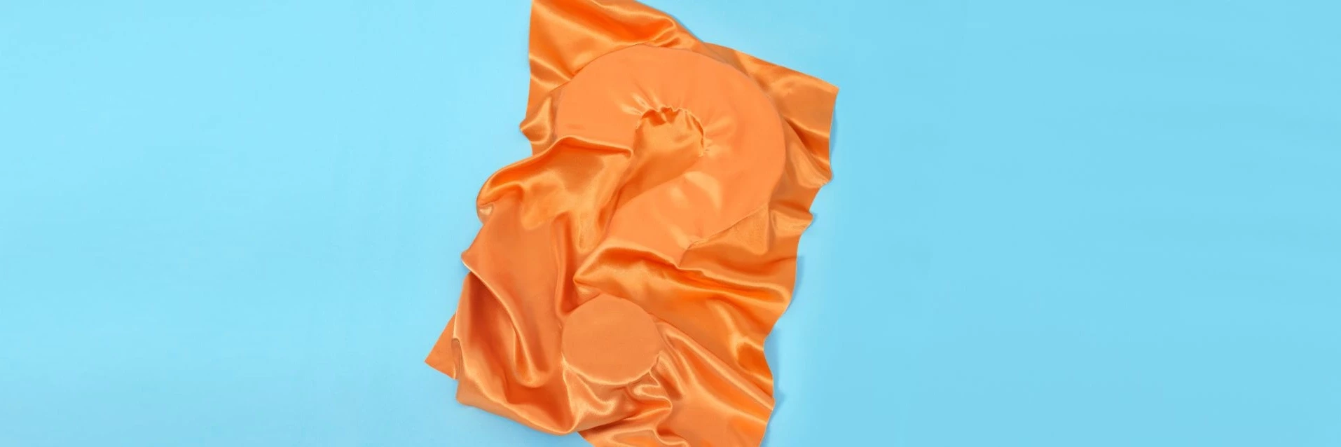 ECO cover picture of a questionmark covered by orange textile