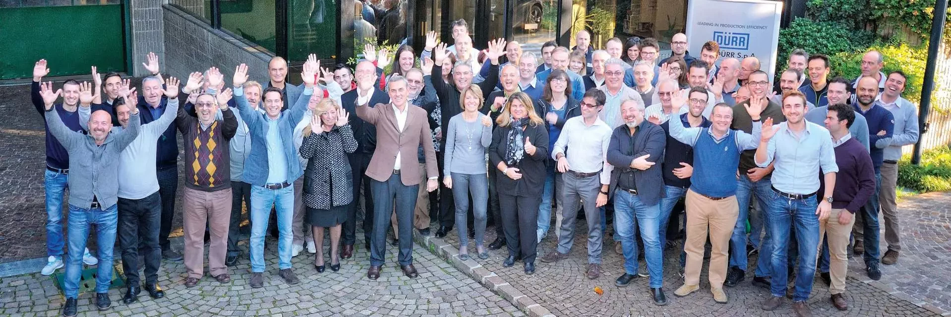 Olpidürr and employees group picture to celebrate their motto