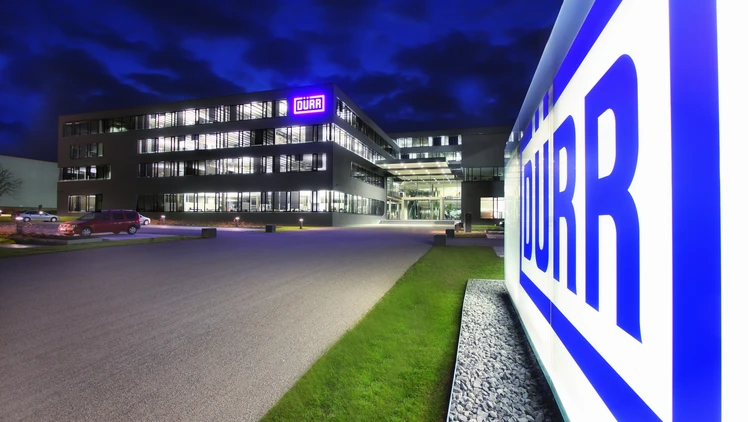 duerr location headquarters in germany at night viewing the shining logo in the front of the building