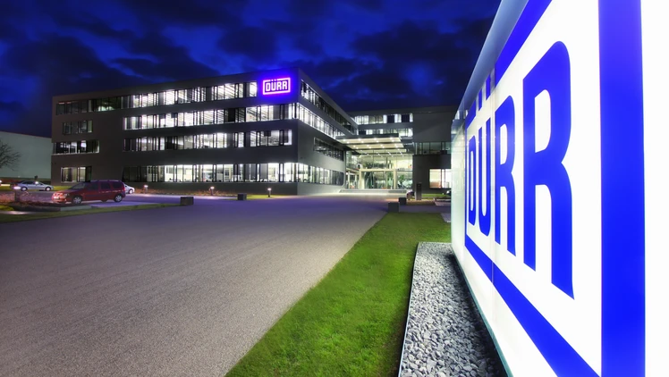 duerr location headquarters in germany at night viewing the shining logo in the front of the building